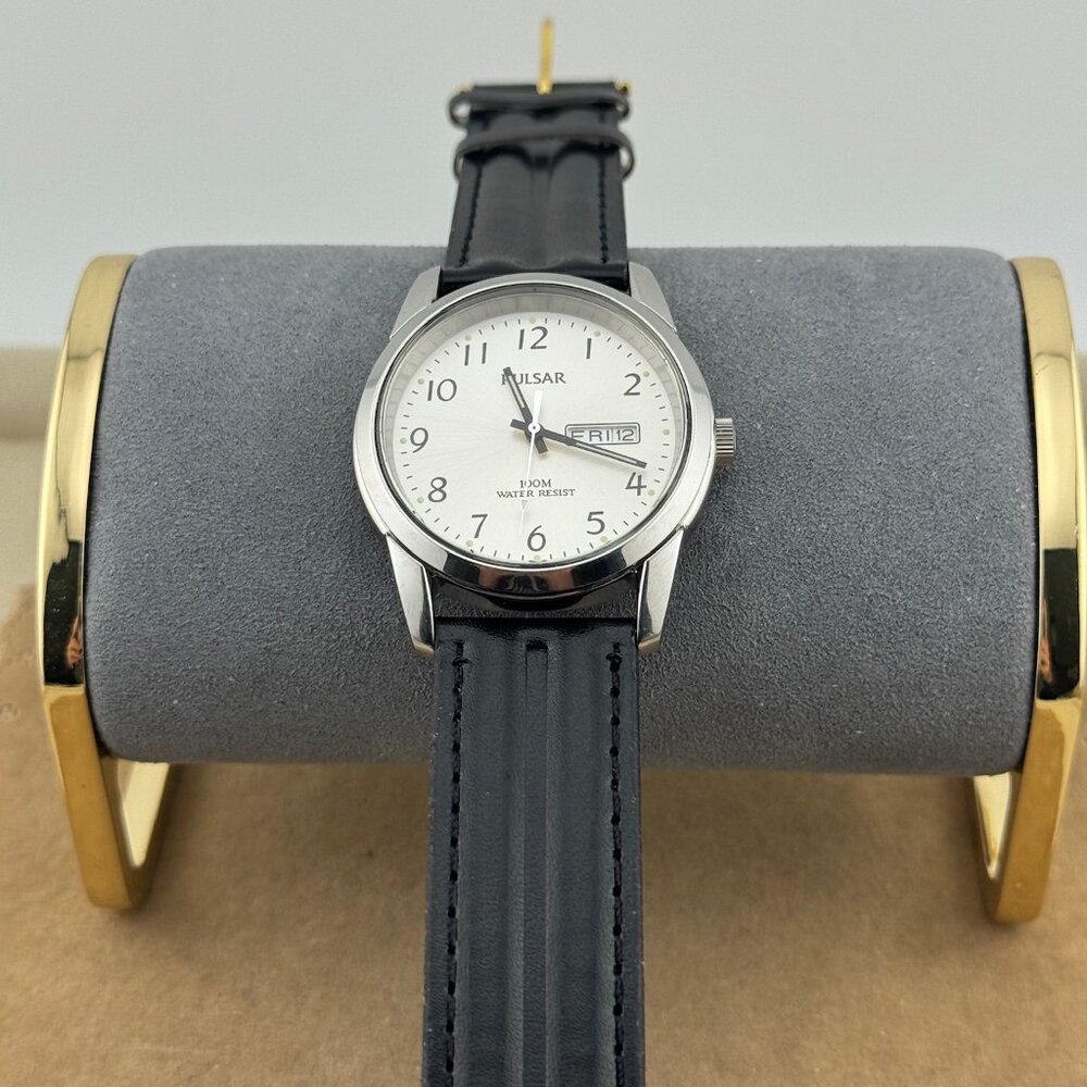 1990's Pulsar Solid Stainless Steel Watch with day and date at 3